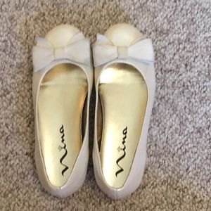 I am selling a cream leather flats.